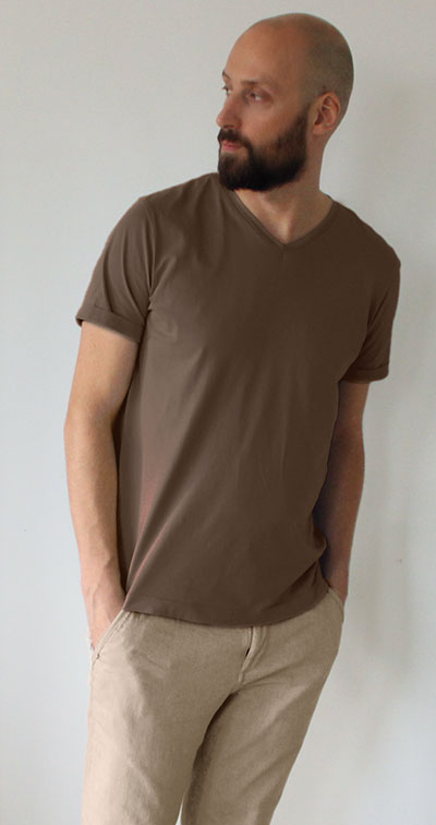 Man wearing brown T-shirt with khaki pants