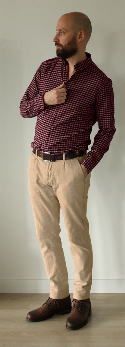 Man wearing burgudndy checked dress shirt with khaki pants