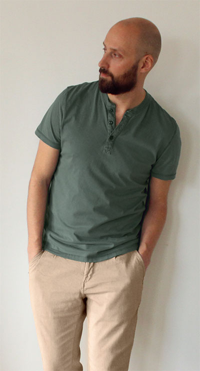 Man wearing dark green T-shirt with khaki pants