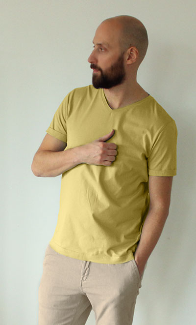 Man wearing yellow T-shirt with khaki pants