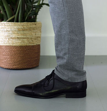 Grey pants with black shoes
